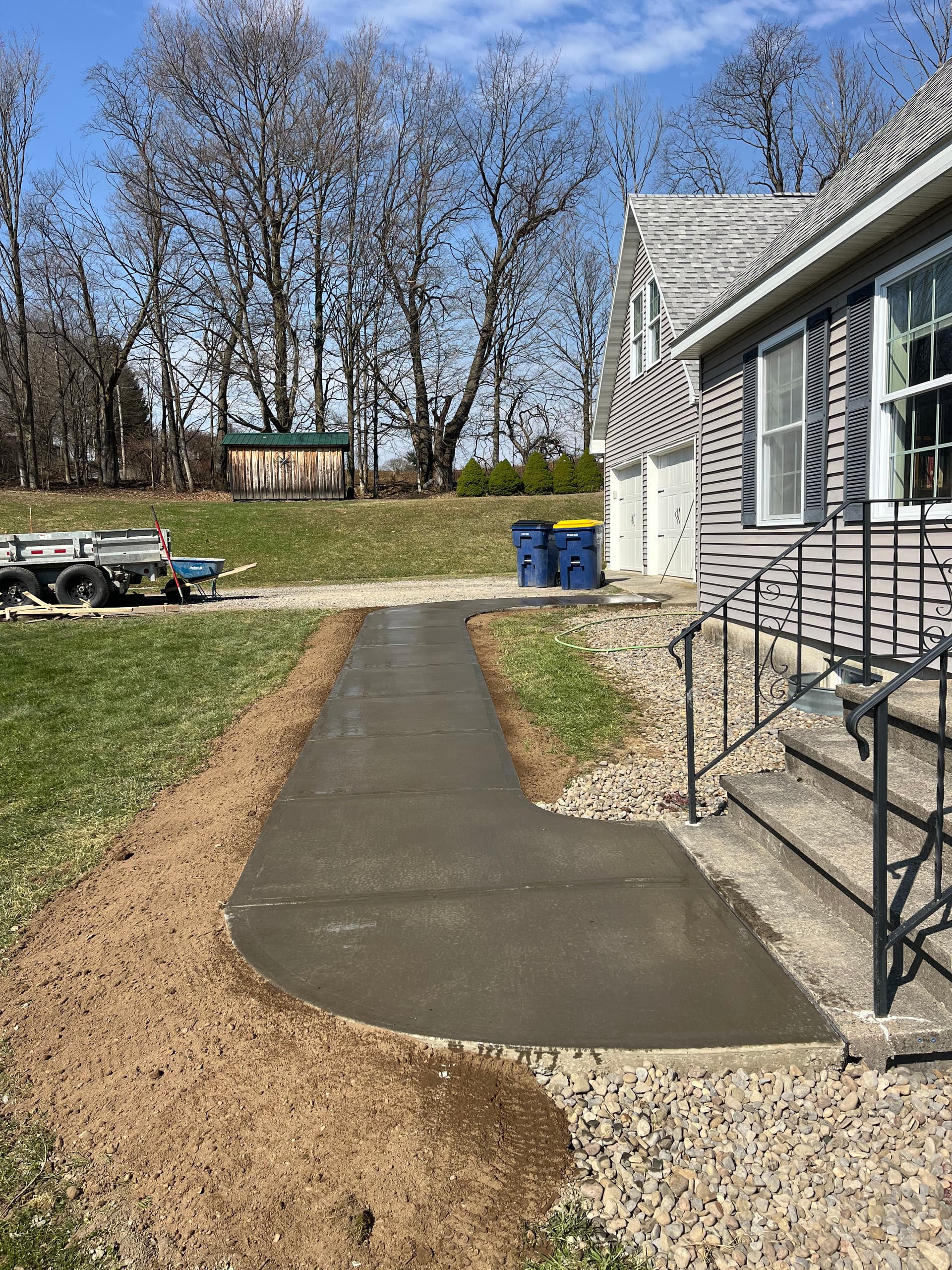 Gallery photos for Muddy Gravel Entrance Gets a Solid Poured Concrete Walkway: Image #2