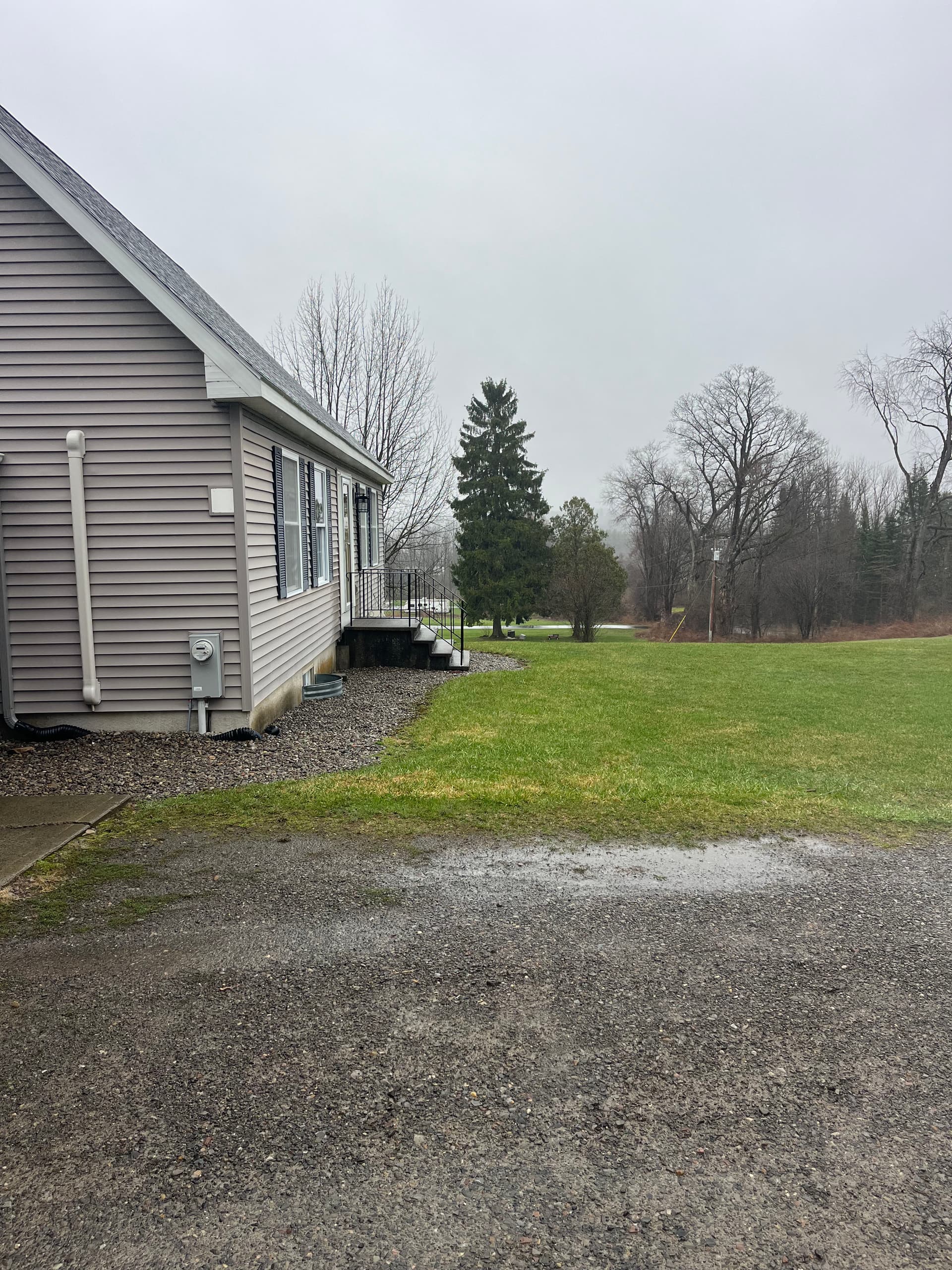 Muddy Gravel Entrance Gets a Solid Poured Concrete Walkway image